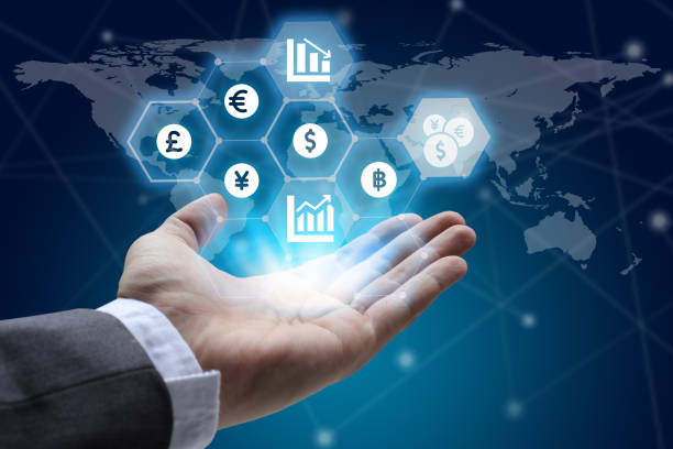 istock hand holding global network using Currencies sign symbol interface of Fintech over the Network connection of World map background, Investment Financial Technology Concept 856285850