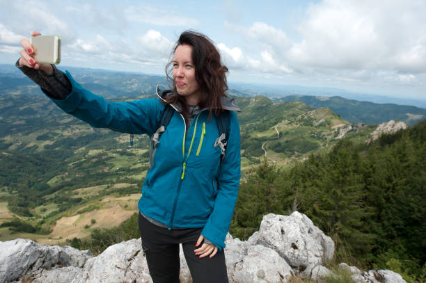 istock Young woman in the mountains. 856286136