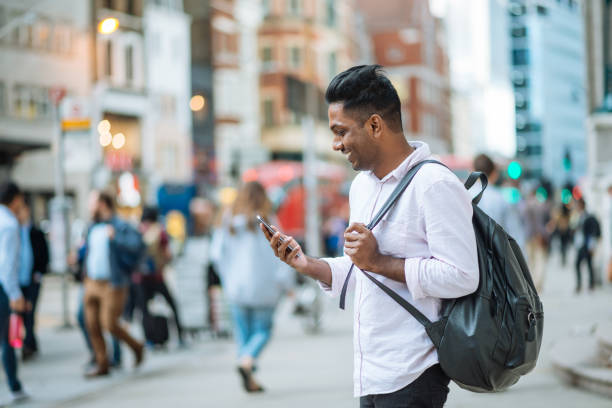 istock Indian man using phone to read the financial news 856304298