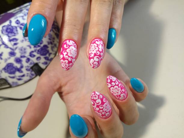 istock Nails of blue and pink color 856304522