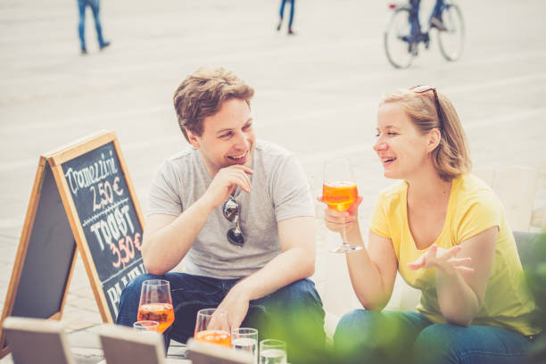 istock Couple drinking cocktail outdoors 856308468