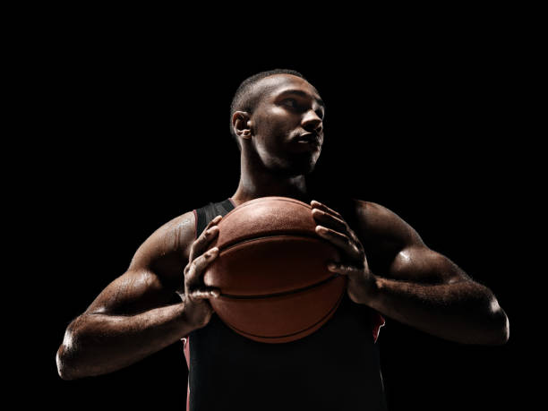 istock The african man basketball player standing with ball 856311296