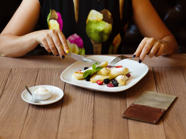 istock Breakfast pancakes. A plate of creamy pancakes with berries on a 856315310