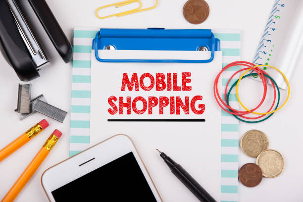 istock Mobile shopping. Office desk with stationery and mobile phone 856315444