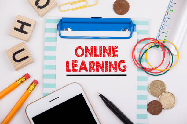 istock Online learning. Office desk with stationery and mobile phone 856317696