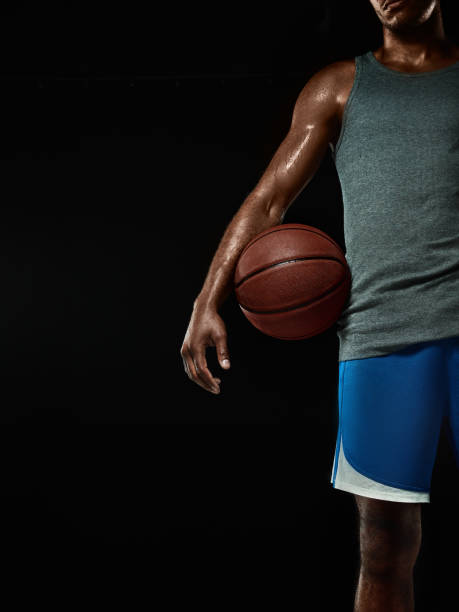 istock The african man basketball player standing with ball 856318508