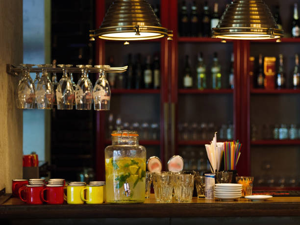 istock Bar counter with cups, straws, plates on a blurred background. J 856318614