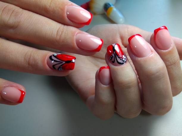 istock Youth manicure with a red butterfly 856321534