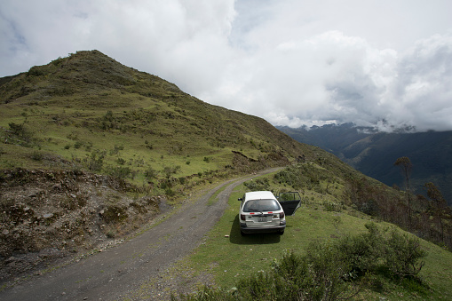 Cusco Region, Peru, April 2017, Andean Highlands, Peruvian Landscape with Car on side of the road