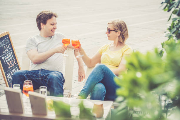 istock Couple drinking cocktail outdoors 856325038