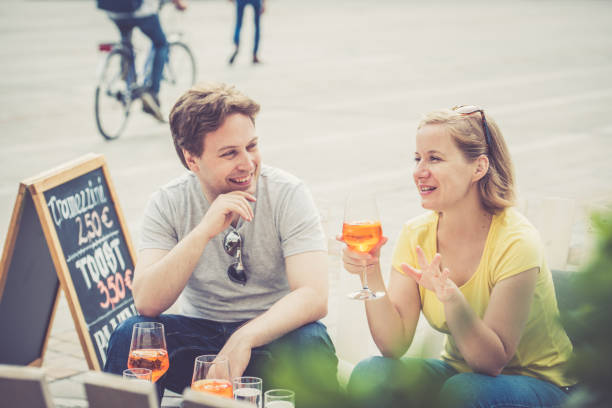 istock Couple drinking cocktail outdoors 856327362