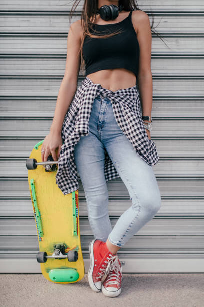 istock Urban woman with longboard 856331130