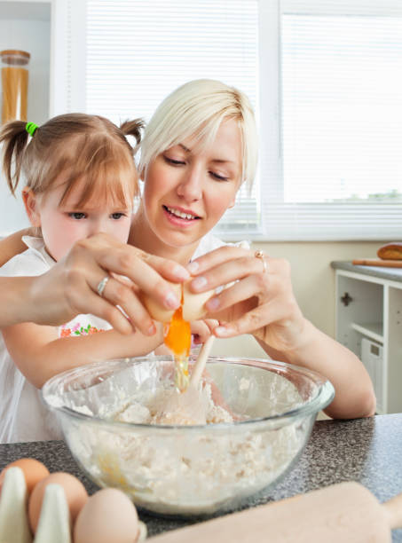 istock Relaxed mother and child baking cookies 856331256