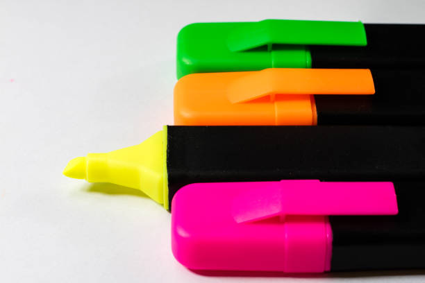 Highlighter on a white background. Office Mazaki to the sketch lie on a white countertop. White background.