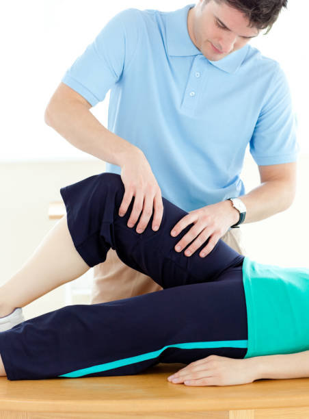 istock Young man doing fitness exercises with a patient in gym 856337622