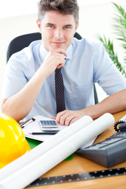 istock Young businessman in front of his desk 856337988