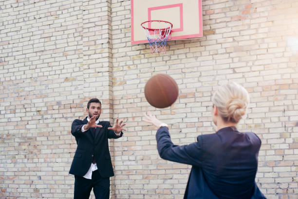 istock business colleagues playing basketball 856338228