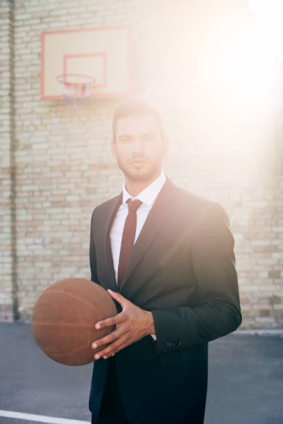 istock businessman with basketball ball 856338762