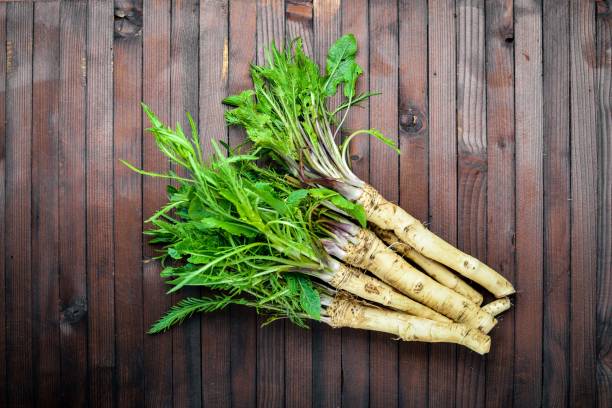 Fresh horseradish. In brown Wooden table. Top view.