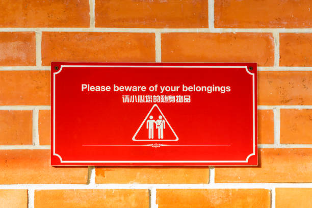 istock Please beware of your belongings sign on red brick wall 856341456