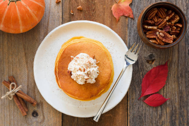 istock Pumpkin pancakes with cream and cinnamon 856342026