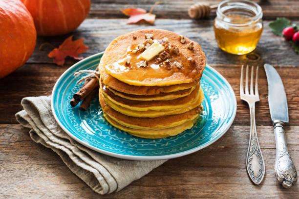istock Pumpkin pancakes with butter, honey and nuts 856342070