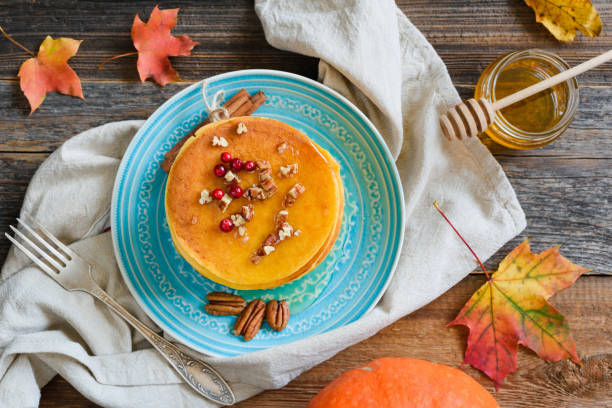 istock Homemade pumpkin pancakes with pecan nuts and honey 856342086