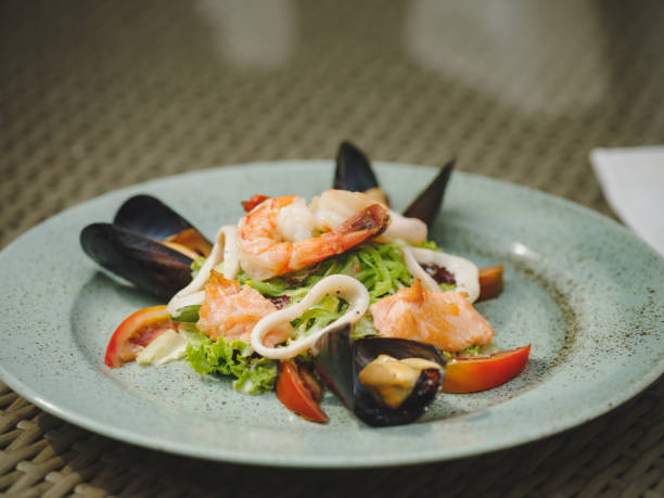 istock The fresh seafood dish in an expensive restaurant. Modern restaurant. Professional kitchen. Beautiful serving of food. 856342446