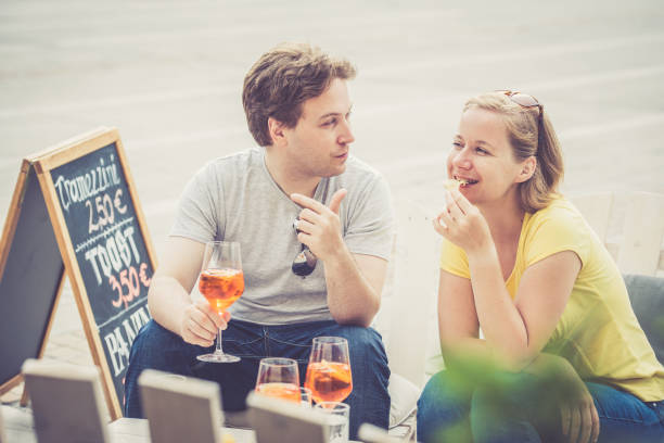 istock Couple drinking cocktail outdoors 856342642