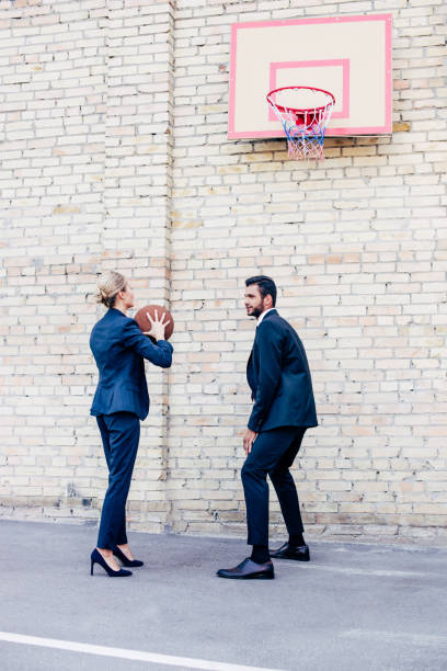 istock business people playing basketball 856345284