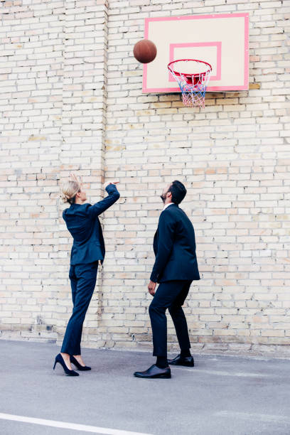 istock business colleagues playing basketball 856346500