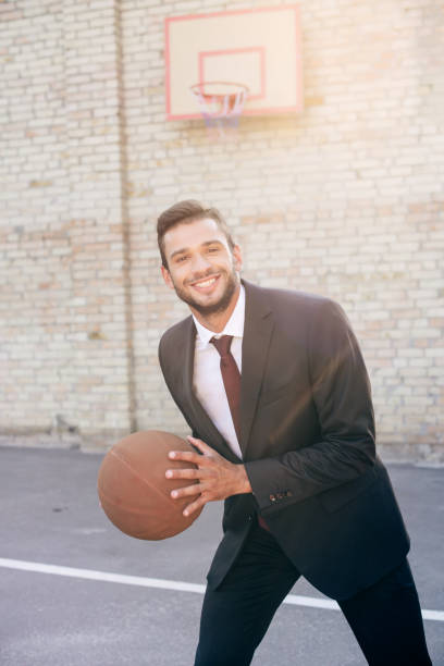 istock businessman with basketball ball 856355838