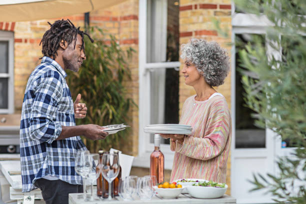 istock Mature friends talking during lunch party 856358732