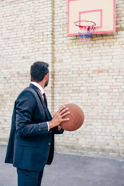 istock businessman with basketball ball 856358806