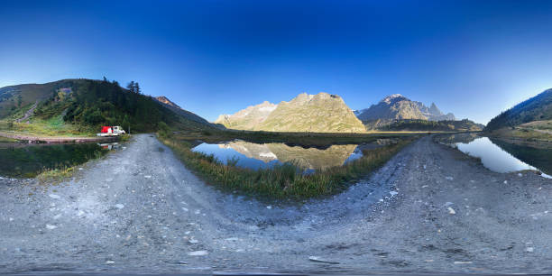 View of a mountain landscape with two lakes and reflection - equirectangular panorama