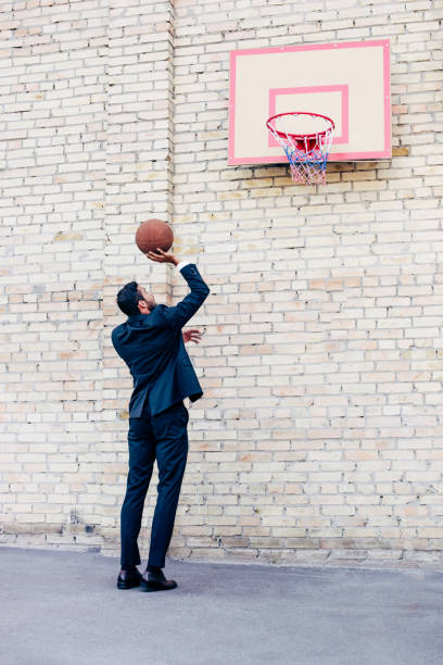 istock businessman playing basketball 856361772