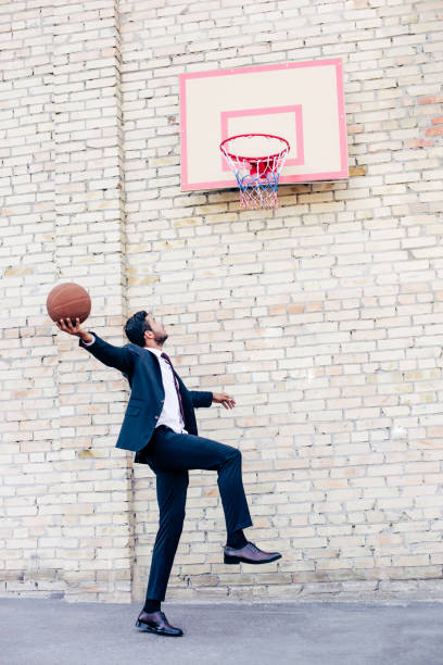 businessman playing basketball