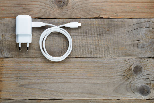 istock Smartphone or tablet charger on wooden table 856362500