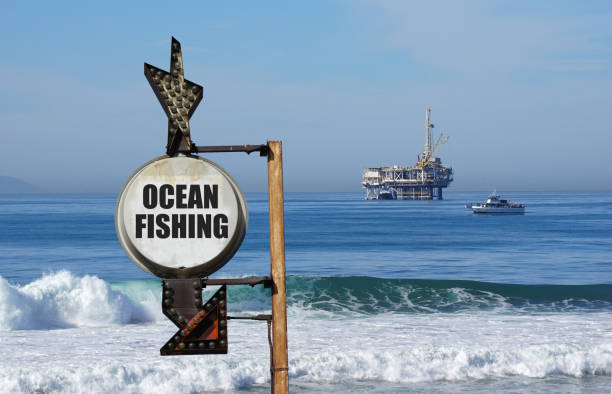 ocean fishing sign with oil platform in ocean