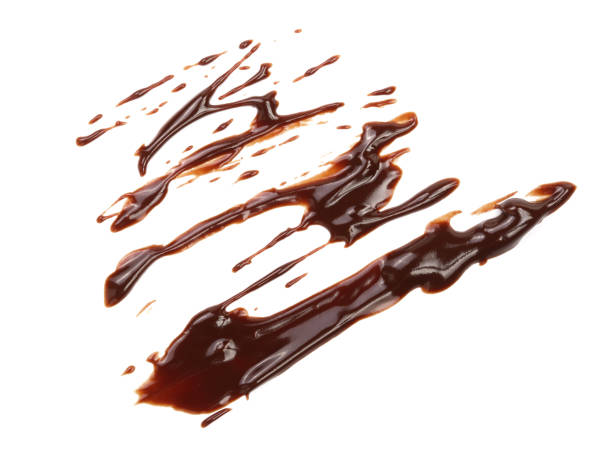 istock Hot melted chocolate pouring isolated on white background, top view 856372620