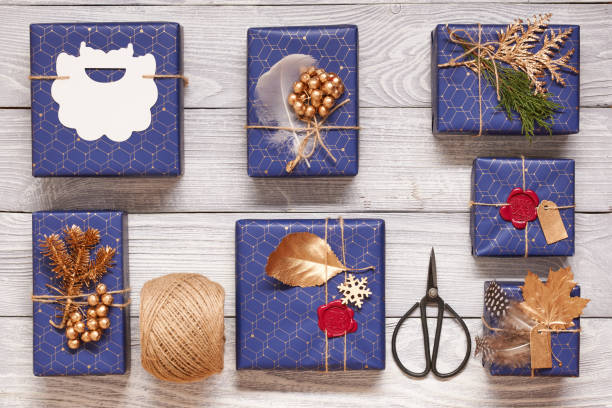 istock Christmas presents on wooden background 856373592