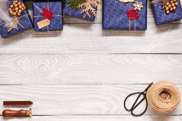 istock Christmas presents on wooden background 856375684