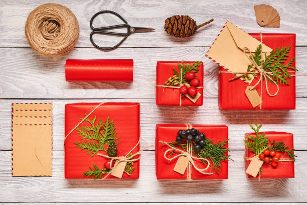 istock Christmas presents on wooden background 856375964