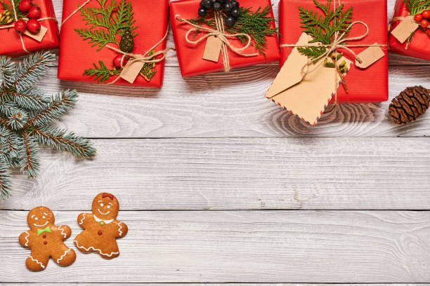 istock Christmas presents on wooden background 856375978