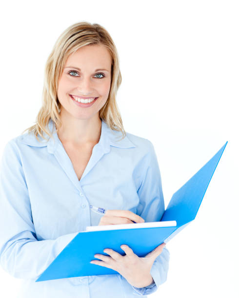 istock Charming businesswoman holding a folder smiling at camera 856378532