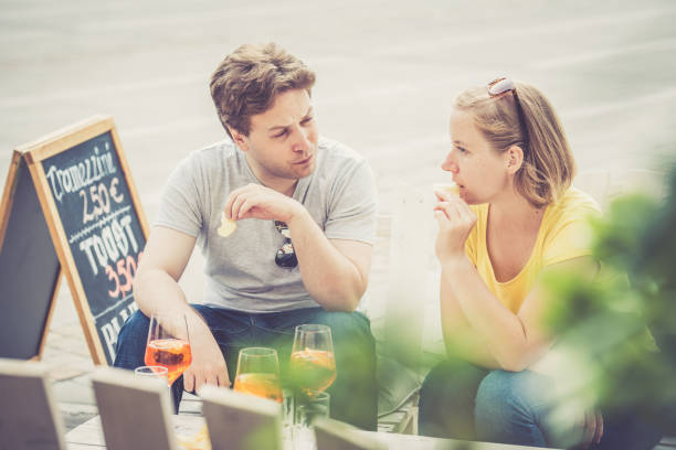 istock Couple drinking cocktail outdoors 856382132