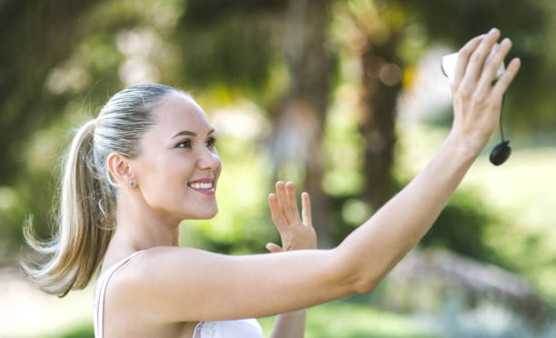 istock Young  woman vlogging outdoors 856382568