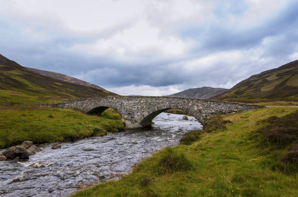 istock Old stone bridge over a river in the Highlands of Scotland 856382716
