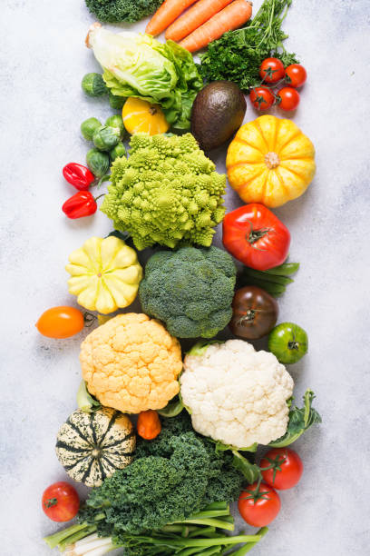 Top view of rainbow vegetables, autumn harvest Overhead table top view colorful rainbow vegetables on the light grey background, copy space for text below, selective focus cruciferous vegetables stock pictures, royalty-free photos & images