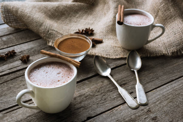 istock cups of cacao and spices on table 856385630